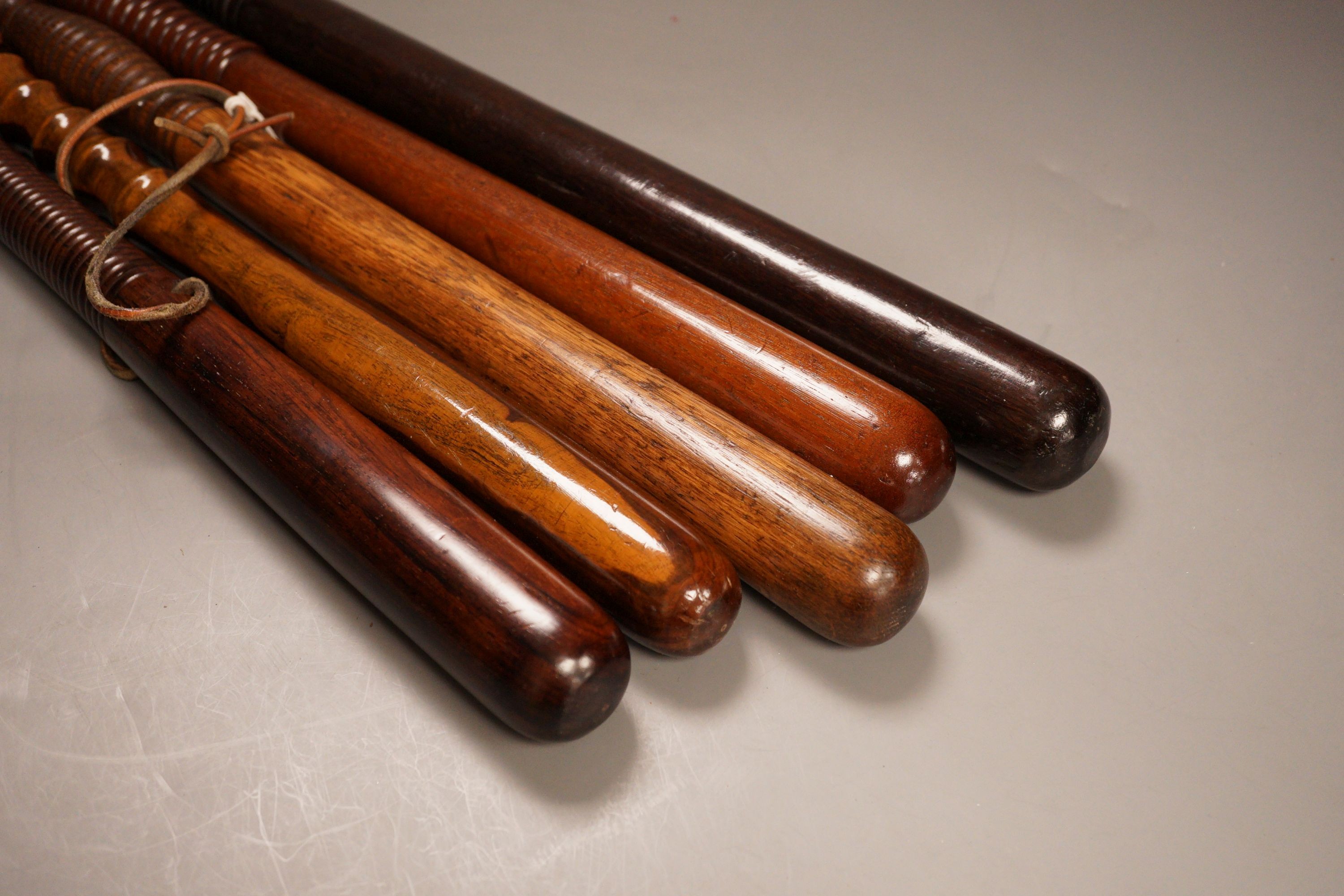 A collection of five assorted 19th century constabulary truncheons in varying woods
